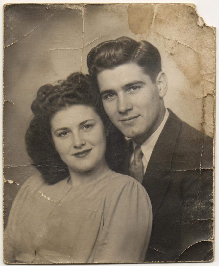 Creased, water-damaged 1940s portrait